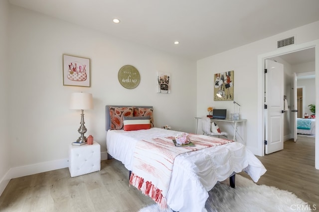 658 S Webster Ave Unit 4, Anaheim, CA 92804 - bedroom featuring wood finished floors, recessed lighting, and baseboards
