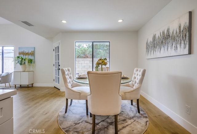 658 S Webster Ave Unit 4, Anaheim, CA 92804 - dining area with light wood-type flooring, baseboards, recessed lighting, and lofted ceiling
