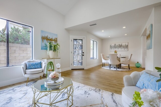 658 S Webster Ave Unit 4, Anaheim, CA 92804 - living room with wood finished floors, lofted ceiling, baseboards, and recessed lighting