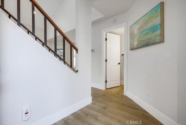 658 S Webster Ave Unit 4, Anaheim, CA 92804 - hall with baseboards, light wood-style flooring, and stairway