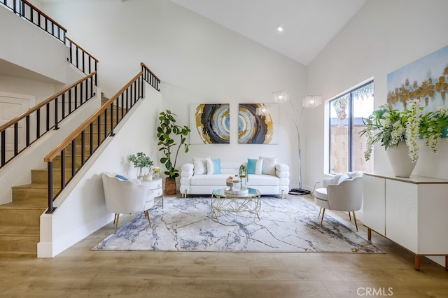 658 S Webster Ave Unit 4, Anaheim, CA 92804 - living area with high vaulted ceiling, wood finished floors, stairway, recessed lighting, and baseboards