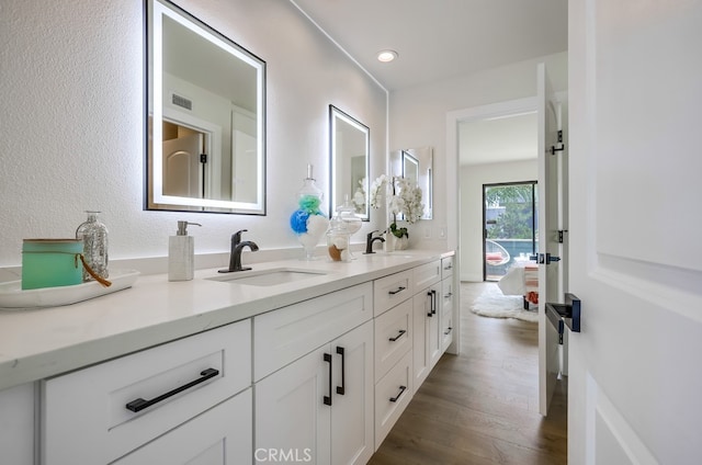 658 S Webster Ave Unit 4, Anaheim, CA 92804 - bathroom with double vanity, wood finished floors, and recessed lighting