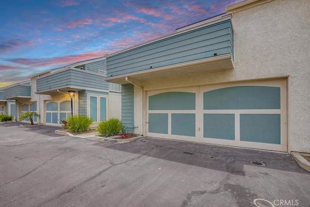 658 S Webster Ave Unit 4, Anaheim, CA 92804 - view of front of property with stucco siding and asphalt driveway