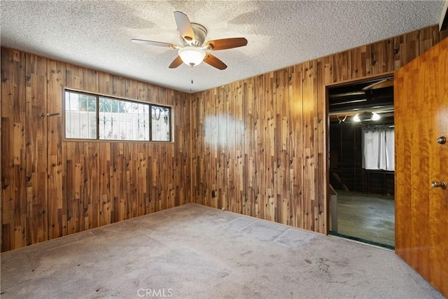 1254 Fieldgate Ave, Hacienda Heights, CA 91745 - empty room featuring wood walls, ceiling fan, a textured ceiling, and carpet