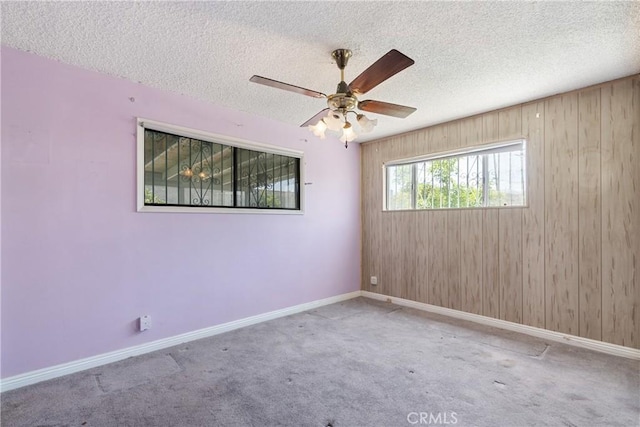 1254 Fieldgate Ave, Hacienda Heights, CA 91745 - carpeted empty room with a ceiling fan, a textured ceiling, and wood walls