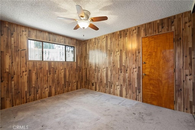 1254 Fieldgate Ave, Hacienda Heights, CA 91745 - carpeted spare room with wooden walls, a ceiling fan, and a textured ceiling