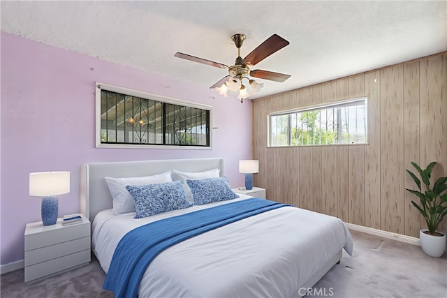 1254 Fieldgate Ave, Hacienda Heights, CA 91745 - carpeted bedroom with wood walls, a textured ceiling, and a ceiling fan
