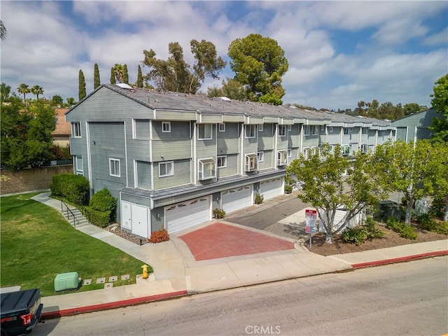 24833 Nueva Vista Dr Unit 2, Laguna Niguel, CA 92677 - view of building exterior featuring a garage and driveway