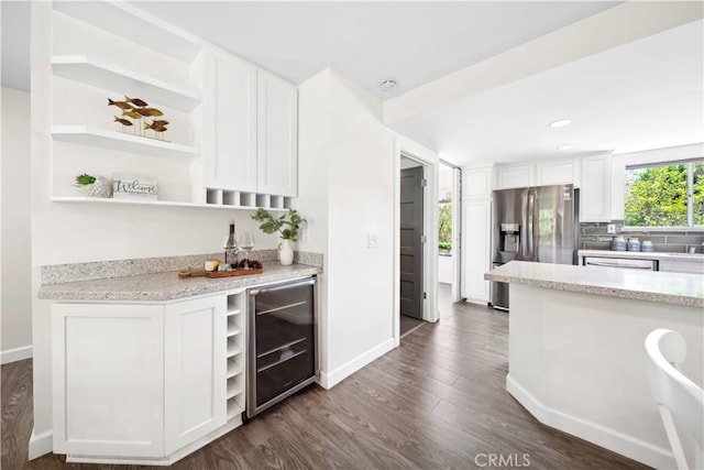 24833 Nueva Vista Dr Unit 2, Laguna Niguel, CA 92677 - kitchen featuring open shelves, beverage cooler, stainless steel appliances, white cabinets, and dark wood-style flooring