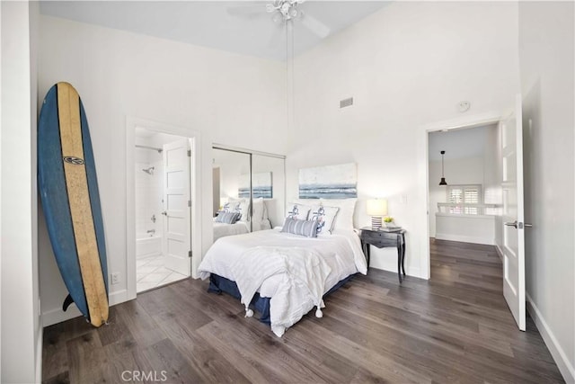 24833 Nueva Vista Dr Unit 2, Laguna Niguel, CA 92677 - bedroom featuring wood finished floors, baseboards, a closet, a towering ceiling, and connected bathroom