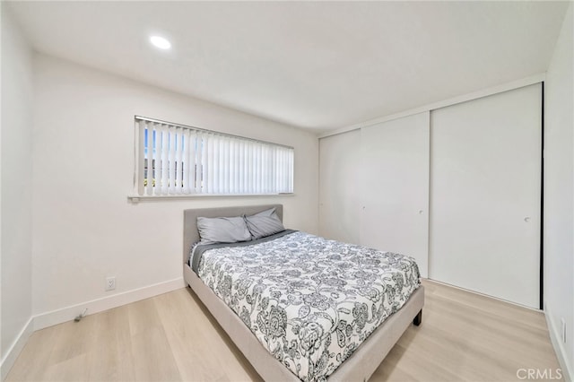 17121 Granada Ln, Huntington Beach, CA 92647 - bedroom with light wood finished floors, a closet, baseboards, and recessed lighting