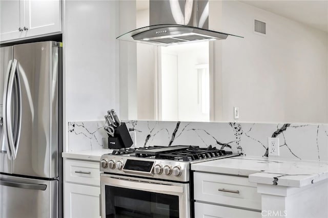 17121 Granada Ln, Huntington Beach, CA 92647 - kitchen featuring stainless steel appliances, extractor fan, decorative backsplash, and white cabinetry