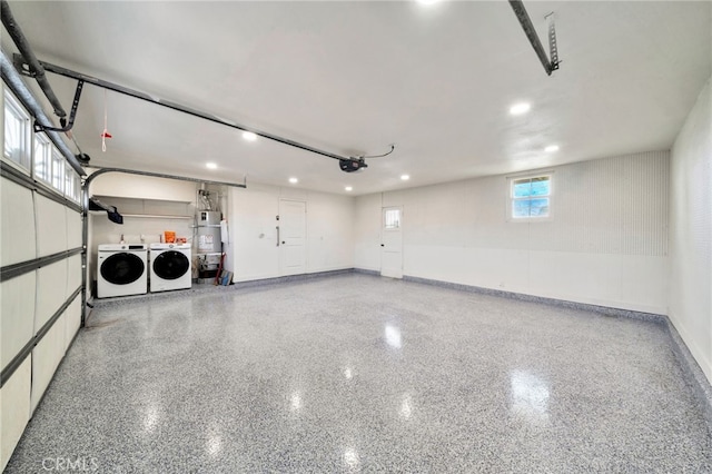 17121 Granada Ln, Huntington Beach, CA 92647 - garage with washing machine and dryer, secured water heater, a garage door opener, baseboards, and recessed lighting