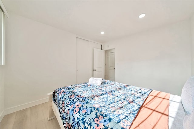17121 Granada Ln, Huntington Beach, CA 92647 - bedroom with light wood finished floors, baseboards, recessed lighting, and a closet
