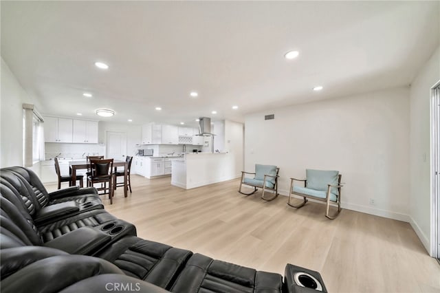 17121 Granada Ln, Huntington Beach, CA 92647 - living room with recessed lighting, light wood-style flooring, and baseboards