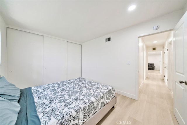 17121 Granada Ln, Huntington Beach, CA 92647 - bedroom with light wood-type flooring, a closet, recessed lighting, and baseboards