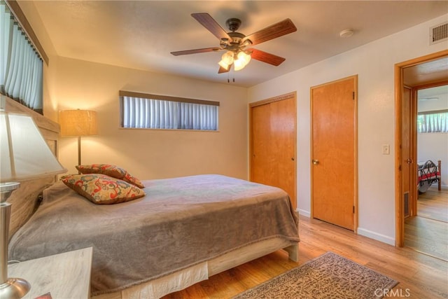 233 E Swift St, Orland, CA 95963 - bedroom with multiple closets, wood finished floors, baseboards, and a ceiling fan