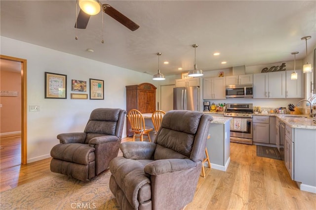 233 E Swift St, Orland, CA 95963 - living room with light wood-style flooring, a ceiling fan, recessed lighting, and baseboards