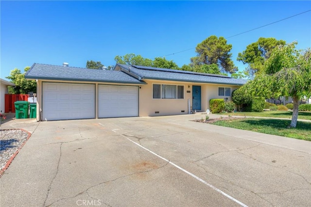 233 E Swift St, Orland, CA 95963 - ranch-style home with a garage, solar panels, stucco siding, and concrete driveway
