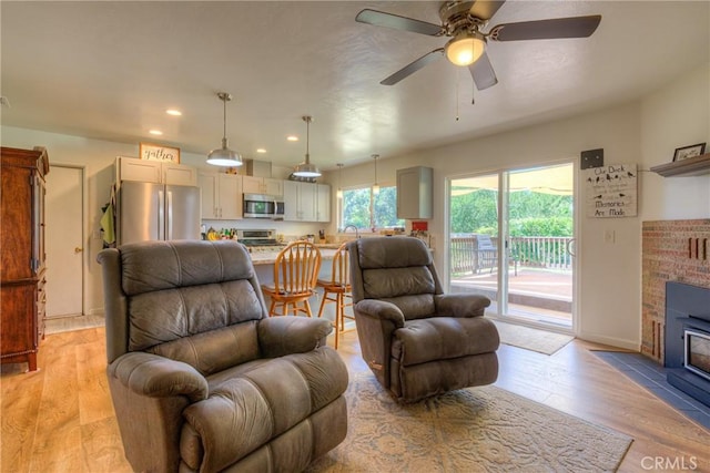 233 E Swift St, Orland, CA 95963 - living area featuring light wood-style floors, ceiling fan, recessed lighting, and baseboards