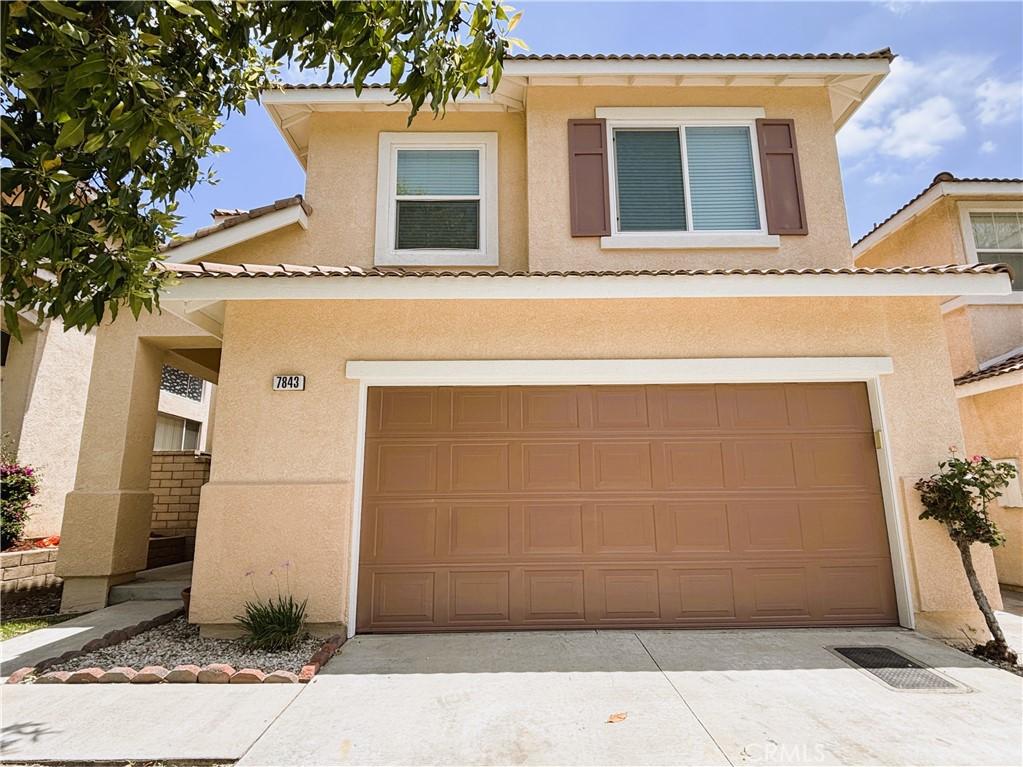 7843 Danner Ct, Rancho Cucamonga, CA 91730 - view of front of house with stucco siding, an attached garage, and a tile roof