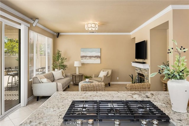 11 Berlamo, Rancho Santa Margarita, CA 92688 - living room featuring crown molding, a fireplace, and baseboards