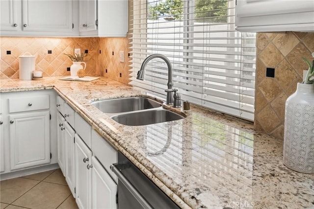 11 Berlamo, Rancho Santa Margarita, CA 92688 - kitchen with a sink, white cabinets, light tile patterned floors, light stone counters, and decorative backsplash