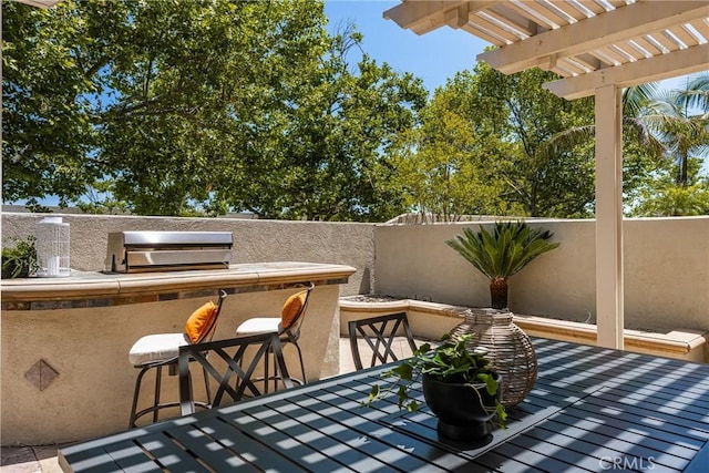 11 Berlamo, Rancho Santa Margarita, CA 92688 - view of patio with a pergola and an outdoor kitchen