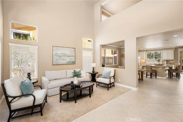 11 Berlamo, Rancho Santa Margarita, CA 92688 - living room featuring a towering ceiling, baseboards, and light tile patterned flooring
