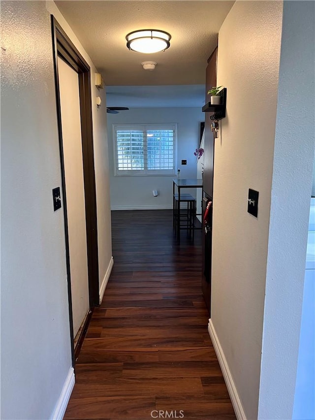 1125 Grand Ave E Unit A, Pomona, CA 91766 - hallway with dark wood-style flooring and baseboards