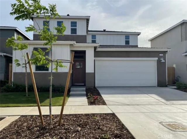 2438 Explorador Dr, Merced, CA 95340 - view of front of property featuring concrete driveway and a garage