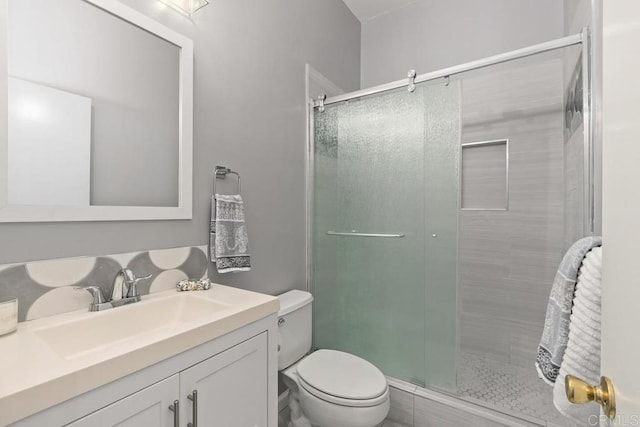 8328 Regents Rd Unit 1K, San Diego, CA 92122 - bathroom with toilet, vanity, and a stall shower