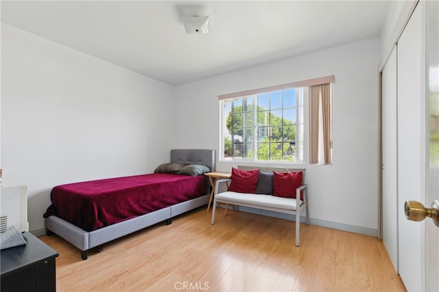 302 E 213th St, Carson, CA 90745 - bedroom featuring light wood-style floors, baseboards, and a closet