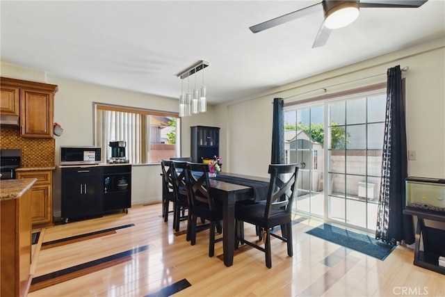302 E 213th St, Carson, CA 90745 - dining room with light wood-type flooring and ceiling fan