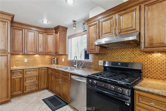 302 E 213th St, Carson, CA 90745 - kitchen featuring appliances with stainless steel finishes, under cabinet range hood, a sink, and brown cabinetry