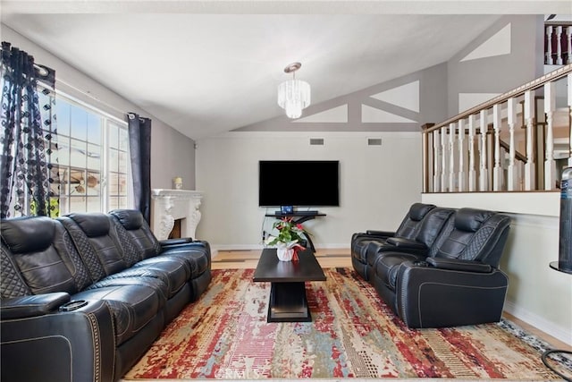 302 E 213th St, Carson, CA 90745 - living room with lofted ceiling, baseboards, wood finished floors, and a fireplace