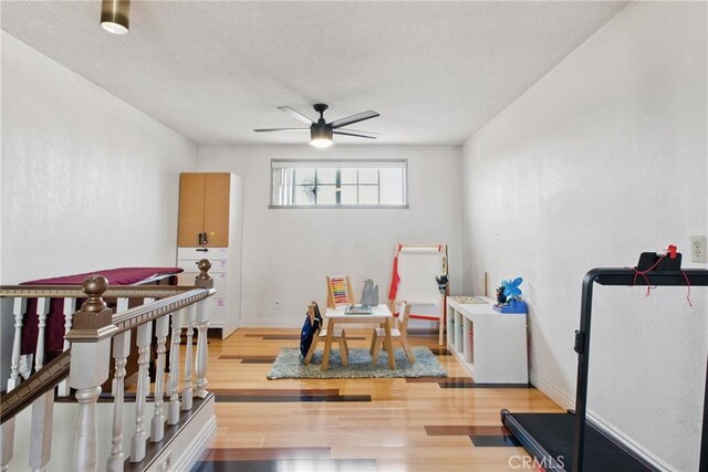 302 E 213th St, Carson, CA 90745 - exercise area featuring ceiling fan, wood finished floors, and a textured ceiling