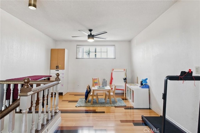 302 E 213th St, Carson, CA 90745 - exercise room with a ceiling fan, wood finished floors, and a textured ceiling