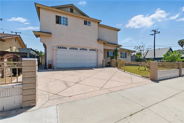302 E 213th St, Carson, CA 90745 - mediterranean / spanish-style house with concrete driveway, an attached garage, and stucco siding