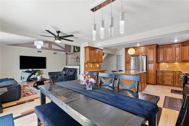 302 E 213th St, Carson, CA 90745 - dining room featuring a ceiling fan and light wood-style floors