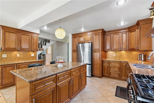 302 E 213th St, Carson, CA 90745 - kitchen featuring freestanding refrigerator, brown cabinetry, a sink, light tile patterned floors, and recessed lighting