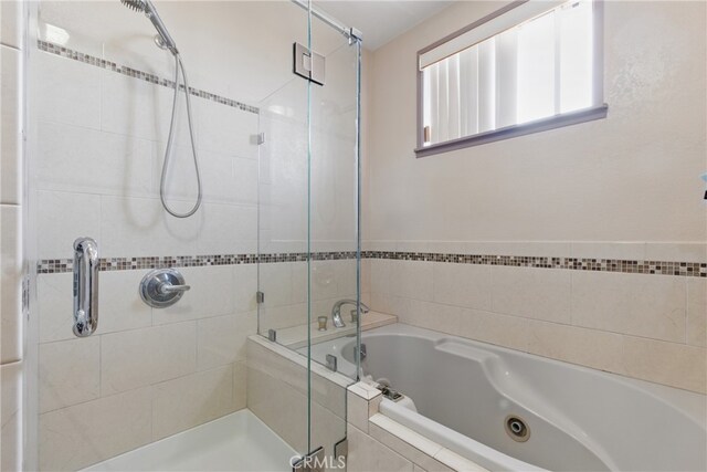 302 E 213th St, Carson, CA 90745 - bathroom featuring a stall shower and a whirlpool tub
