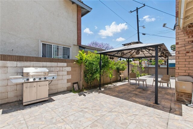 302 E 213th St, Carson, CA 90745 - fenced backyard featuring a gazebo, a patio area, and area for grilling