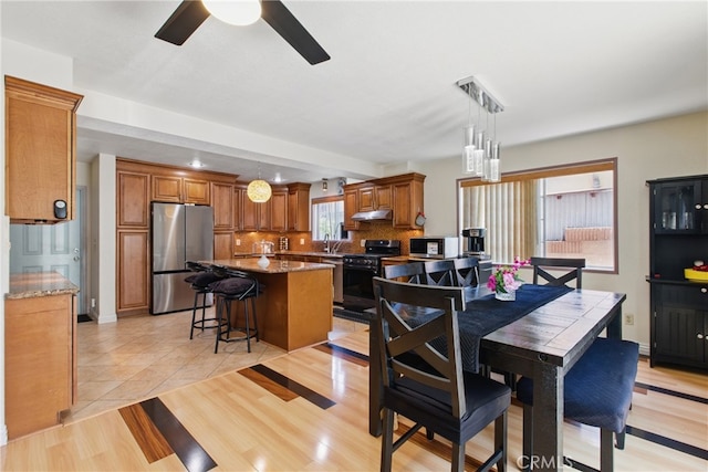 302 E 213th St, Carson, CA 90745 - dining space with ceiling fan and light wood-type flooring