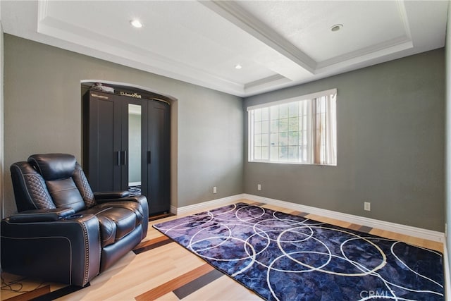 302 E 213th St, Carson, CA 90745 - living area featuring light wood-style flooring, a raised ceiling, and baseboards