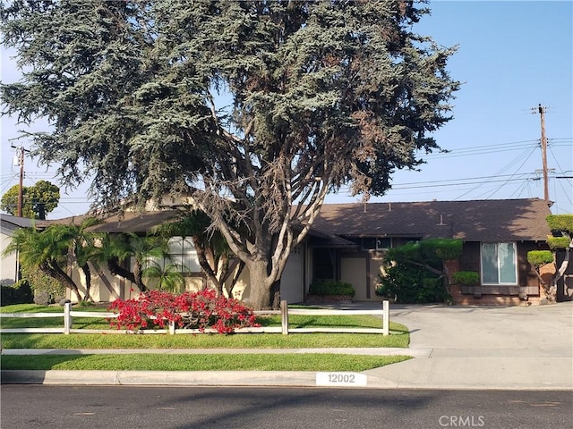 12002 Grovedale Dr, Whittier, CA 90604 - view of front of property with a shingled roof and a front yard