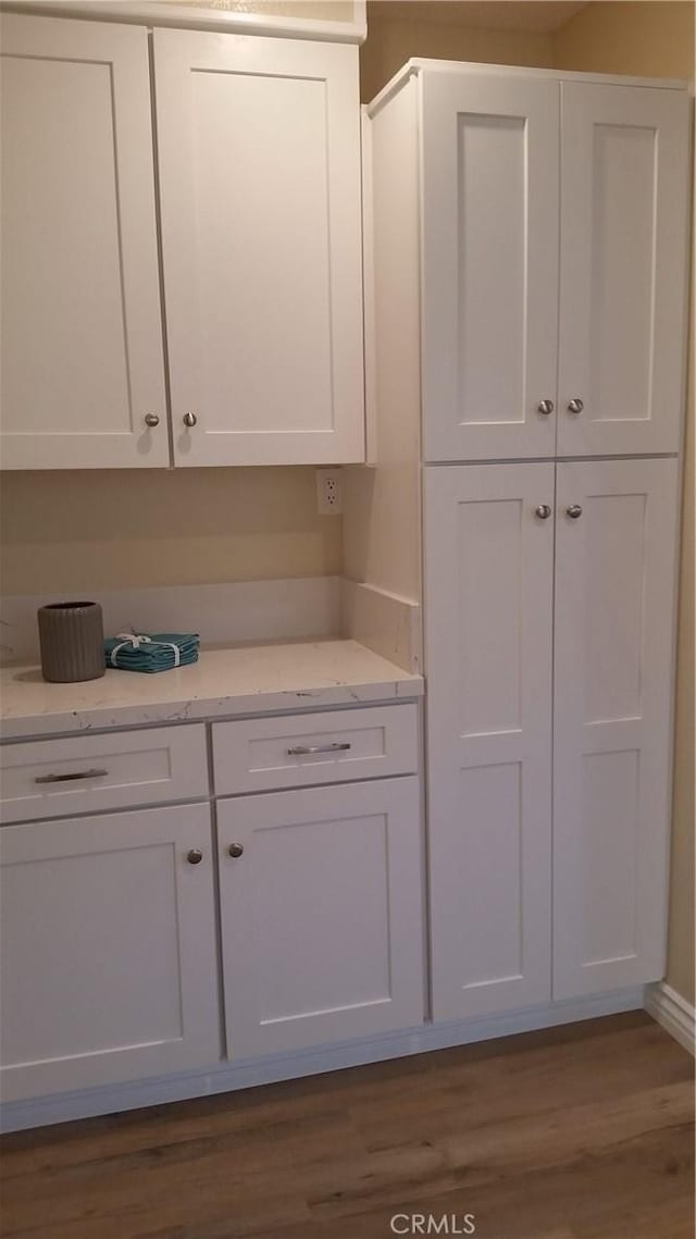 2652 College Ln, La Verne, CA 91750 - kitchen featuring white cabinetry, dark wood finished floors, and light stone counters