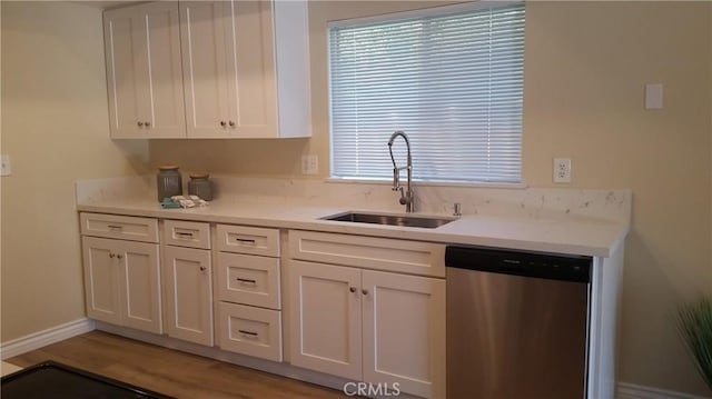 2652 College Ln, La Verne, CA 91750 - kitchen with dishwasher, a sink, white cabinets, light countertops, and light wood finished floors