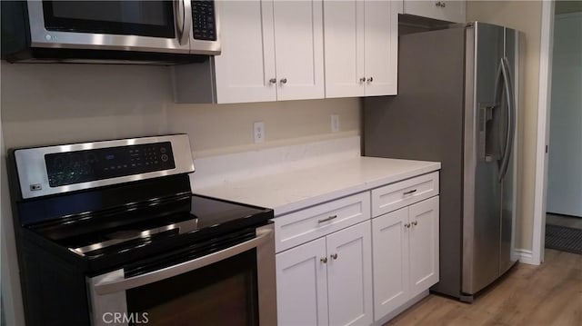 2652 College Ln, La Verne, CA 91750 - kitchen featuring stainless steel appliances, white cabinets, and light wood-type flooring