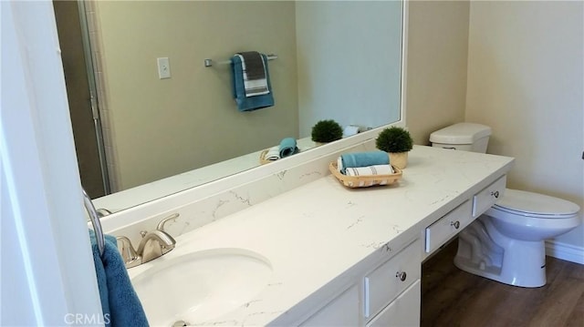 2652 College Ln, La Verne, CA 91750 - bathroom with toilet, vanity, and wood finished floors